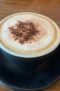 A cup of coffee is placed on the table (2) Stock Photos