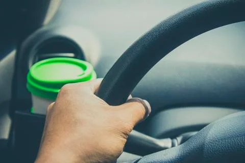 Cup coffee put on front console of a car Stock Photos