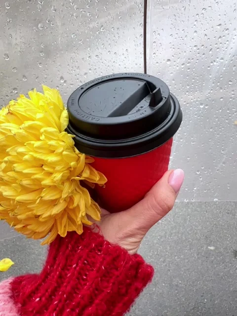 A cup of coffee in a red cup against the background of rain Stock Footage 258142614