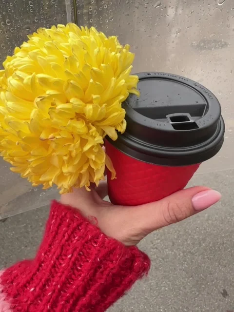A cup of coffee in a red cup against the background of rain Stock Footage 258143866