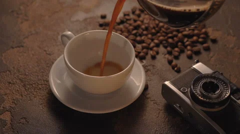 Cup of coffee with retro camera Stock Footage 65742296