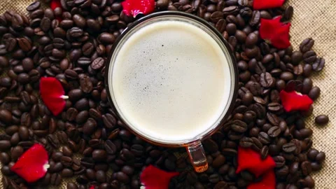 Cup Coffee On Roasted Coffee Beans and Rose Petal Rotated. Stockbeeldmateriaal 194631802