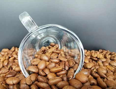 Cup of coffee with roasted dark brown coffee beans Stock Photos