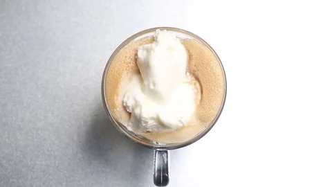 Cup of coffee on a rotating plate Stock Footage