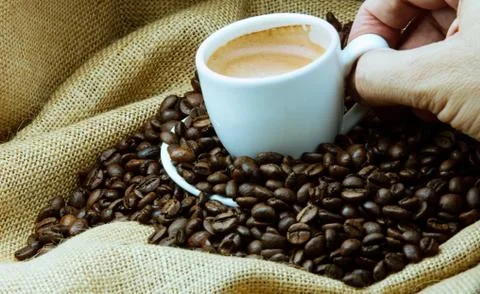 Cup of coffee on a sack Stock Photos