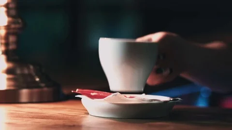 Cup of coffee on a saucer close-up Video stock 76570426