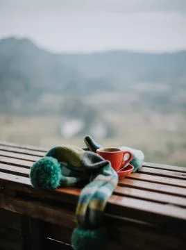 A cup of coffee in a scarf Stock Photos
