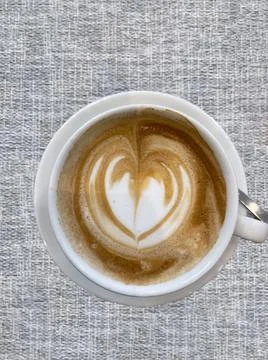 Cup of coffee served on a table Stock Photos
