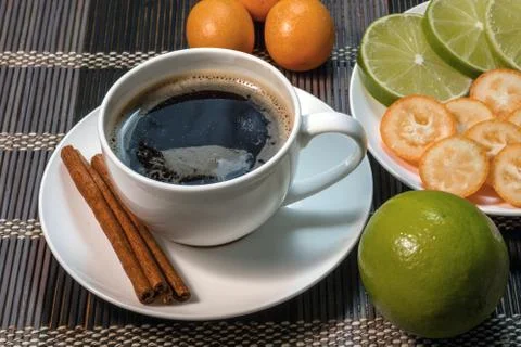 A cup of coffee with slice lime Stock Photos