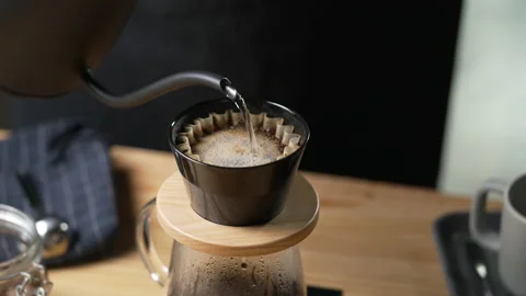 Cup of coffee with smoke and coffee beans on old wooden background Stock Footage 191635079