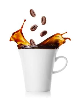Cup of coffee with splash from falling beans Stock Photos