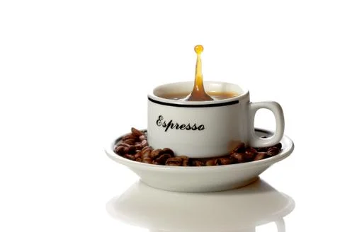 A cup of coffee with a splash Stock Photos