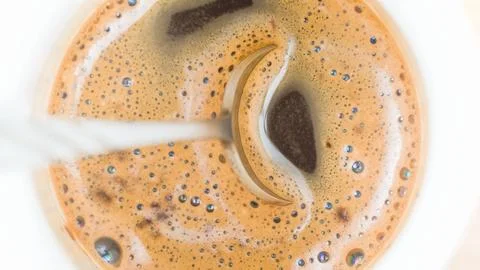 Cup of coffee with spoon in it Stock Photos