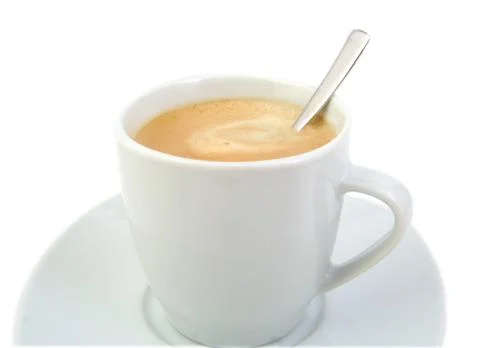 Cup of coffee with a spoon Stock Photos