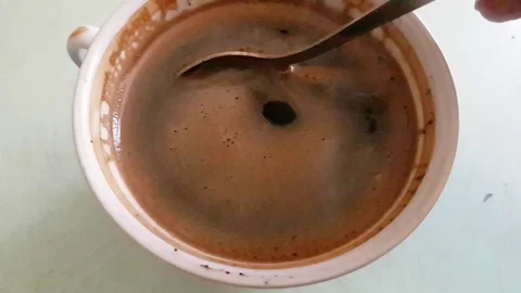 Cup of coffee with a spoon, slow-motion Stock Footage 90398721