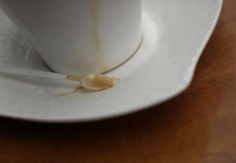 Cup of coffee with spoon on table 스톡 사진