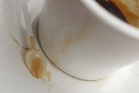 Cup of coffee with spoon on table Stock-Fotos