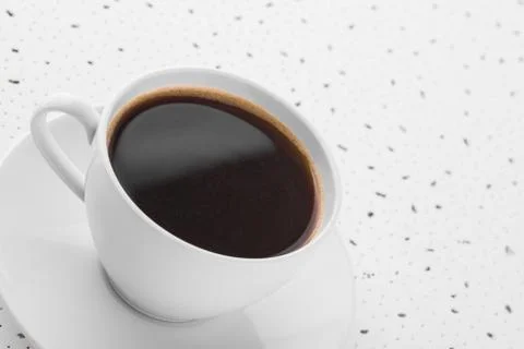 Cup of coffee on spotty background Stock Photos