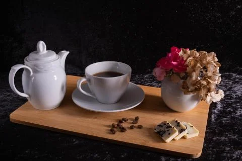 A cup of coffee stand on a tray. Stock Photos