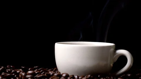 Cup of coffee with steam on black background, hot drink Stock Footage 97378482