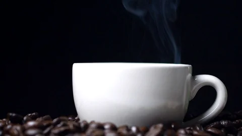 Cup of coffee with steam on black background, hot drink Stock Footage 97378679