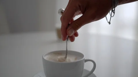 Cup of Coffee. Stirring with spoon. Close up of a beautiful coffee. Stirring Stock Footage 101463892