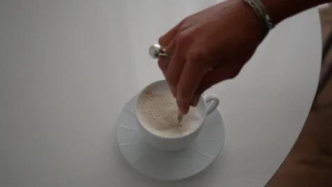 Cup of Coffee. Stirring with spoon. Close up of a beautiful coffee. Stirring Stock Footage 101463958