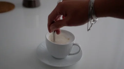 Cup of Coffee. Stirring with spoon. Close up of a beautiful coffee. Stirring Stock Footage 101463966