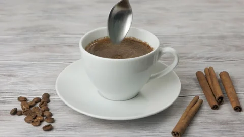 Cup of Coffee. Stirring with spoon Stock Footage 98301813