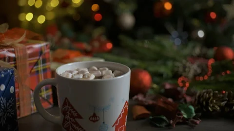 Cup of coffee with straw on a table during christmas time Video stock 165032353