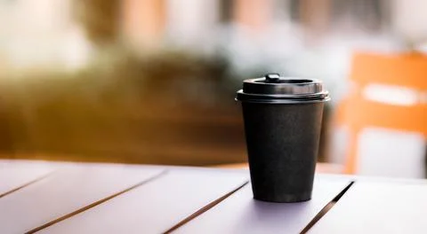A cup of coffee on a street table Foto stock