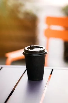 A cup of coffee on a street table Stock Photos