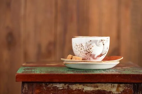 Cup of coffee with sugar on a beautiful rustic background Stock Photos
