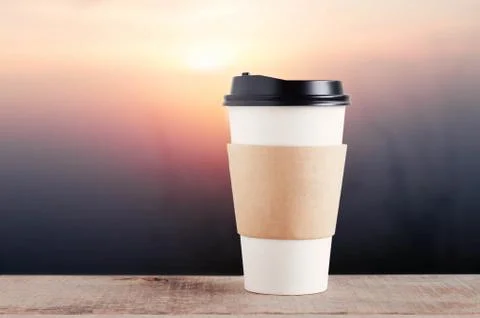 Cup of coffee with sunrise. Stock Photos