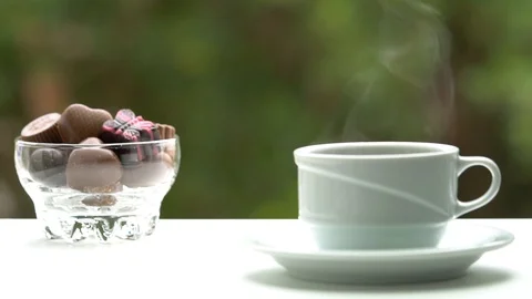 Cup of coffee with Sweets or Candy  Chocolates Stock Footage 85975337