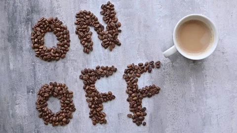 Cup of coffee as a switch between ON and OFF beans 스톡 동영상 251219045