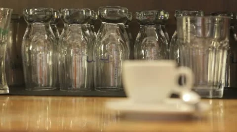 Cup with coffee on a table and glasses Stock Footage 11482667