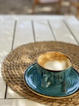 Cup of coffee on table in beach cafe Stock Photos