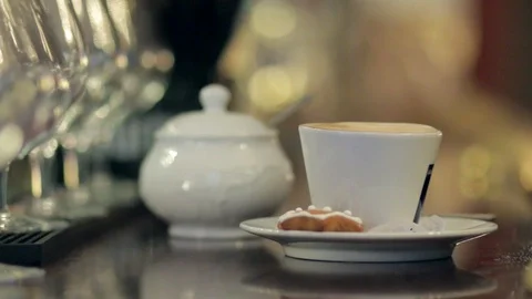 Cup of coffee on the table with blurred lights on background. Stock Footage 88784581