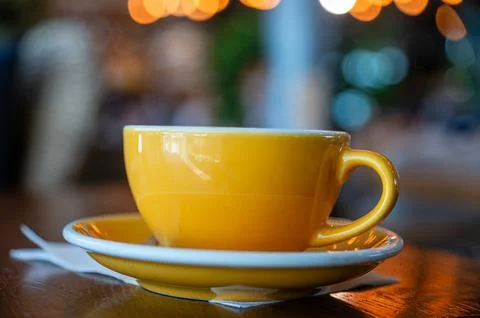 Cup of coffee on a table in a cafe during morning hours Foto stock