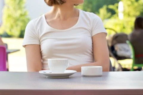 Cup of coffee on a table at the cafe Stock Photos