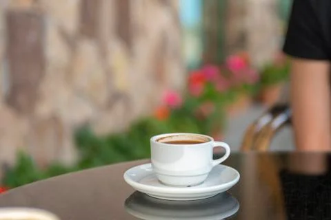 A cup of coffee on a table in a cafe Stock Photos