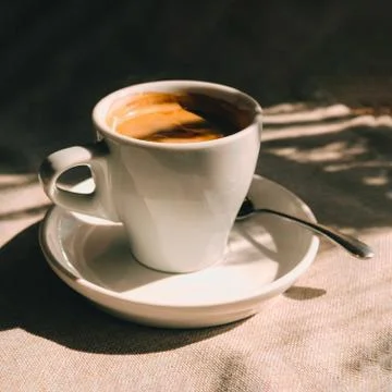 Cup of coffee on table in cafe 스톡 사진