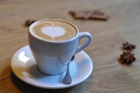 Cup of coffee on table in cafe Stock Photos
