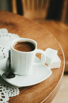 Cup of coffee on table in cafe Photos