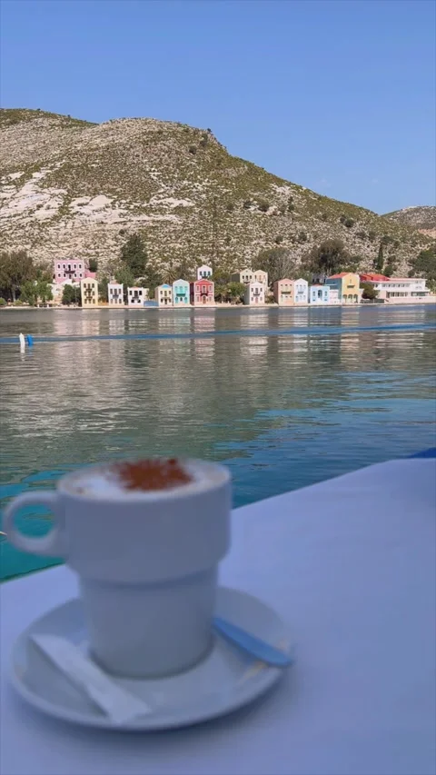 A cup of coffee on a table in a cafe on the promenade by the sea Stock Footage 279919069