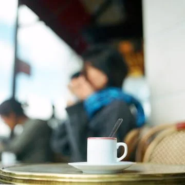 Cup of coffee on table at cafe terrace 스톡 사진