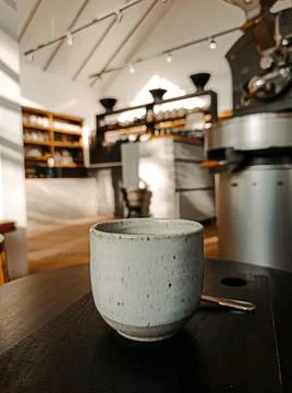 A cup of coffee on a table in a Coffee Shop Stock Photos