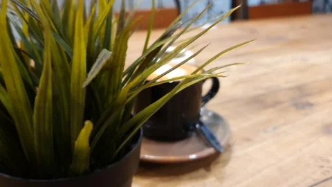 Cup of coffee on a table. cup off cappucino coffee on a table Stock Footage 279295238