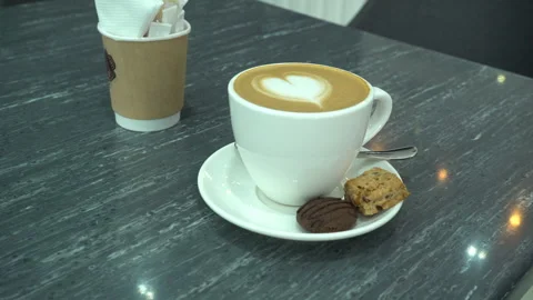 A cup of Coffee on the table Stock Footage 229859628